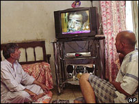 Viewers in Baghdad watching Al-Arabiya satellite TV station, 2004