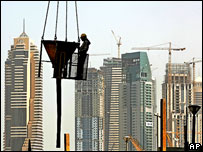 Construction worker and high-rise buildings, Dubai