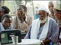 Coffee shop patrons listen to the news in Baidoa