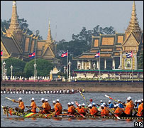 boats speed by Royal Palace, Phnom Penh, Cambodia, 2006
