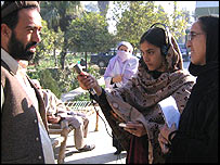 Female Afghan journalist conducts interview