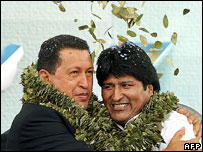 Hugo Chavez (left) and Evo Morales wearing garlands of coca   leaves, Dec 06