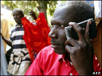 Man listens to radio during election time, February 2007, Dakar
